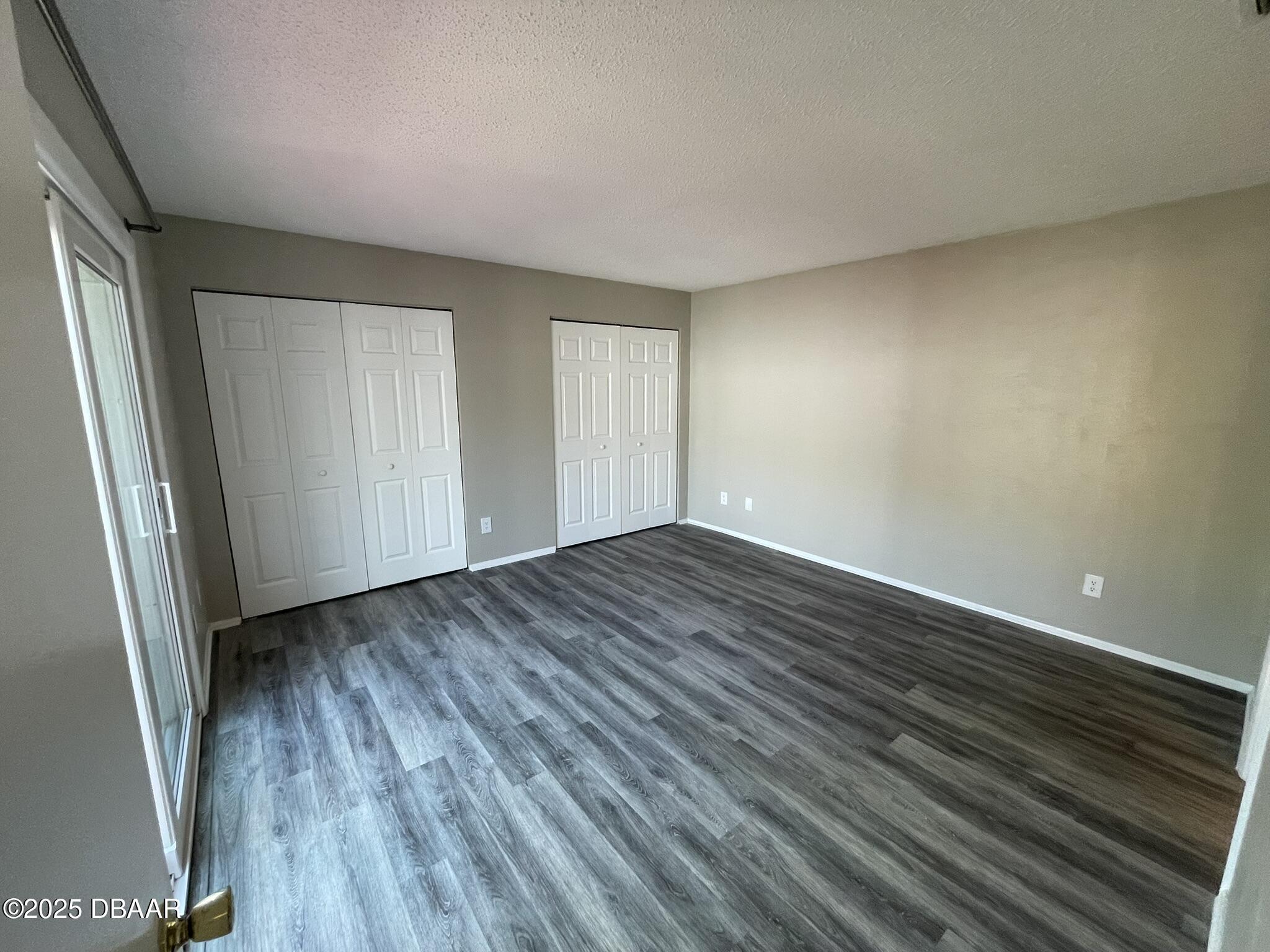 97 Springwood Square Port Orange, FL 32129 - Photo 16 of 23 wooden floor in an empty room with a window