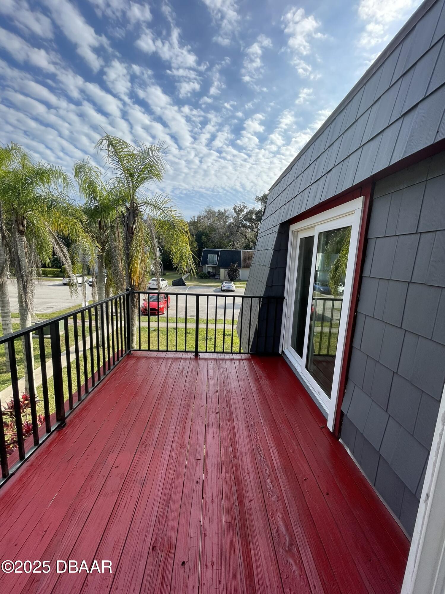 97 Springwood Square Port Orange, FL 32129 - Photo 20 of 23 a view of balcony with wooden floor