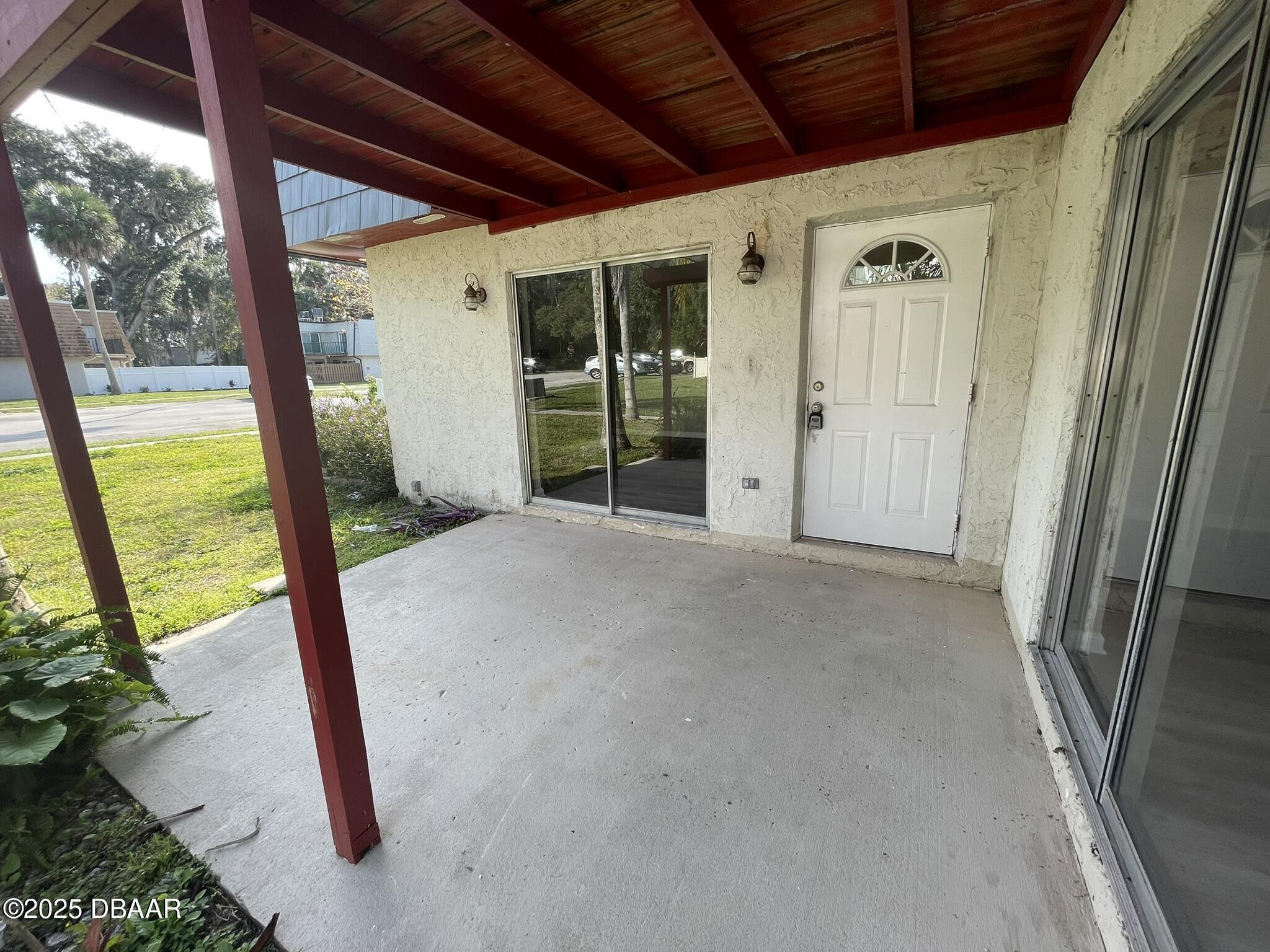 97 Springwood Square Port Orange, FL 32129 - Photo 3 of 23 a view of a porch