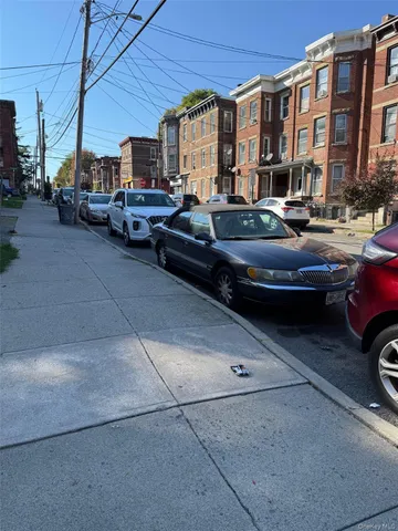 a front view of a house with parking space