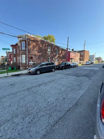 a view of street with parked cars