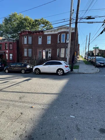 a view of a car parked in front of a house
