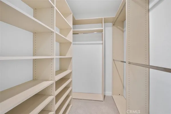 a view of an empty walk in closet