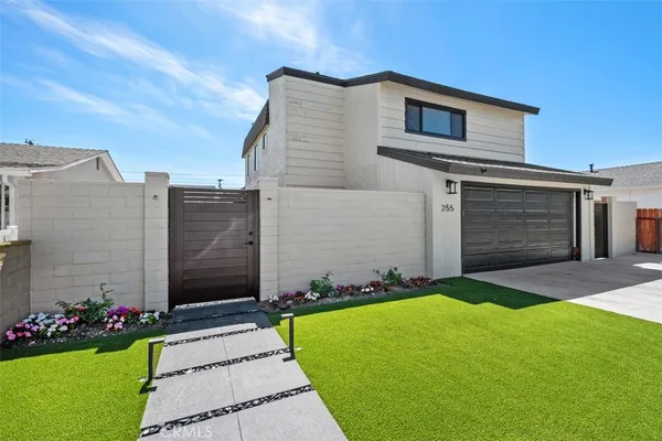 a front view of house and yard with green space