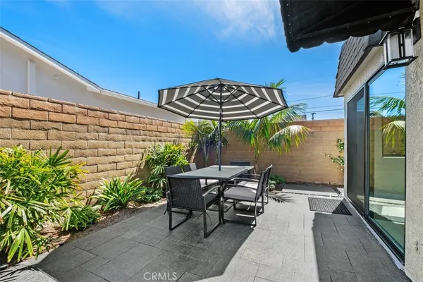 a patio with table and chairs
