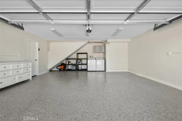 a view of an empty room with chandelier