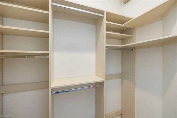 a view of an empty walk in closet