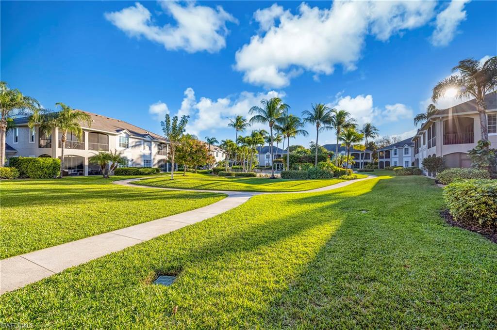 5025 Maxwell Circle, Unit 2 Naples, FL 34105 - Photo 22 of 24 a view of a house with a big yard