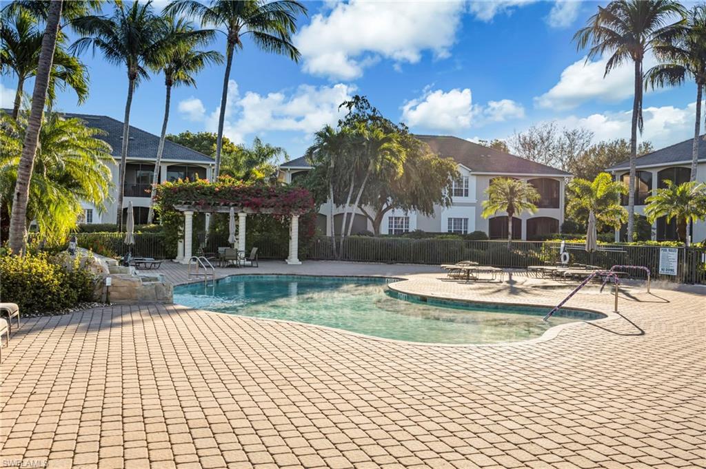 5025 Maxwell Circle, Unit 2 Naples, FL 34105 - Photo 23 of 24 a view of a house with a swimming pool