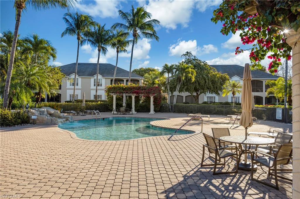 5025 Maxwell Circle, Unit 2 Naples, FL 34105 - Photo 24 of 24 a view of a swimming pool with a patio