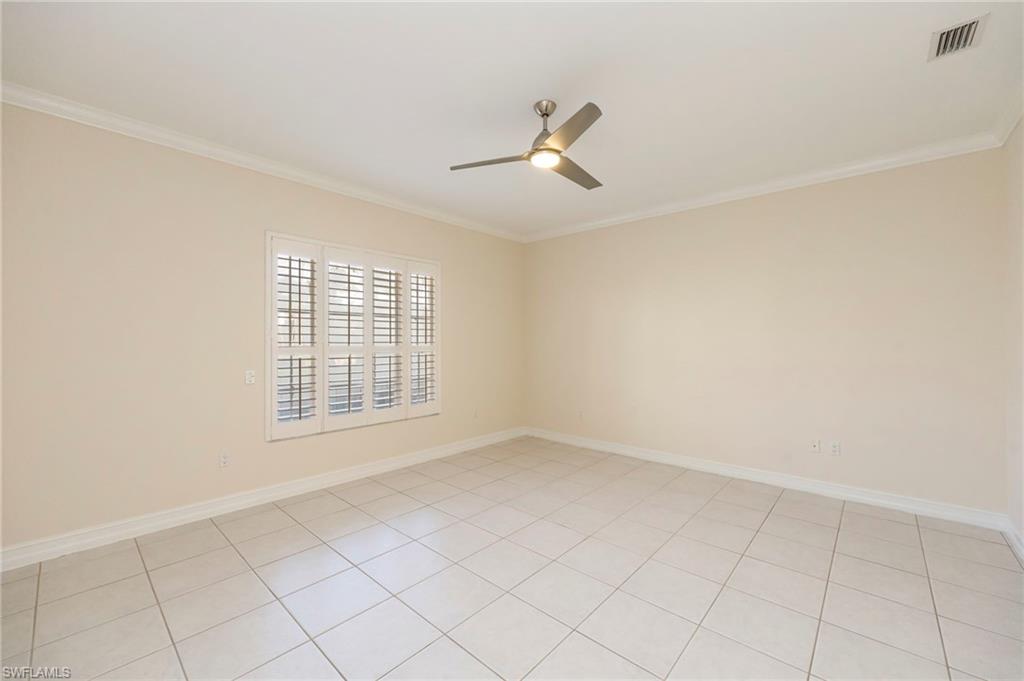 5025 Maxwell Circle, Unit 2 Naples, FL 34105 - Photo 9 of 24 a view of an empty room with a window
