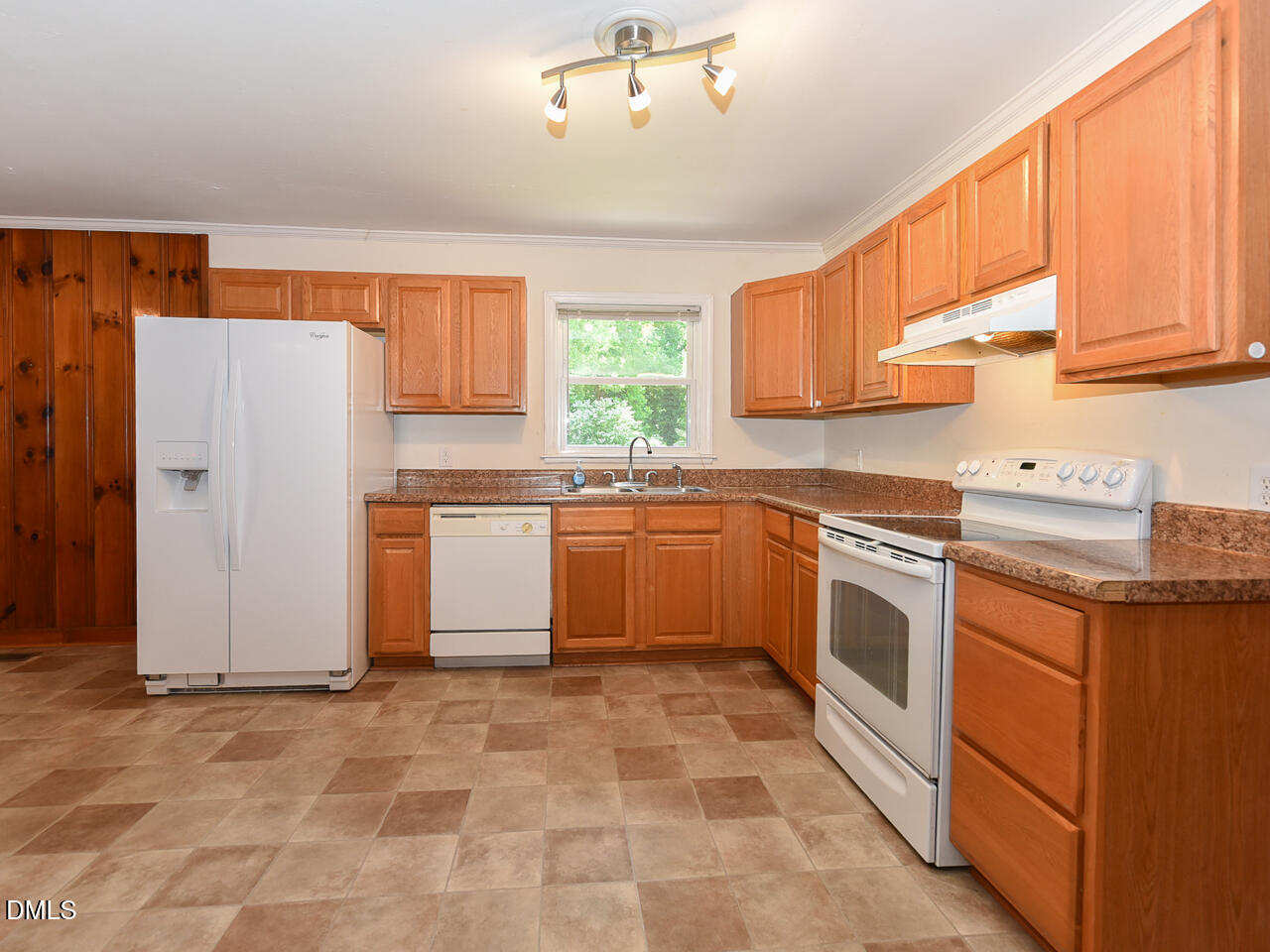 1703 St Patrick Drive Raleigh, NC 27603 - Photo 6 of 29 a kitchen with a stove top oven sink and cabinets