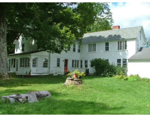 15 S Road Heath, MA 01346 - Photo 3 of 17 a backyard of a house with table and chairs potted plants and large tree