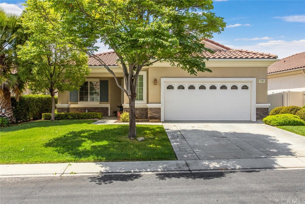 1747 Brittney Road Beaumont, CA 92223 - Photo 1 of 1 a front view of a house with garden