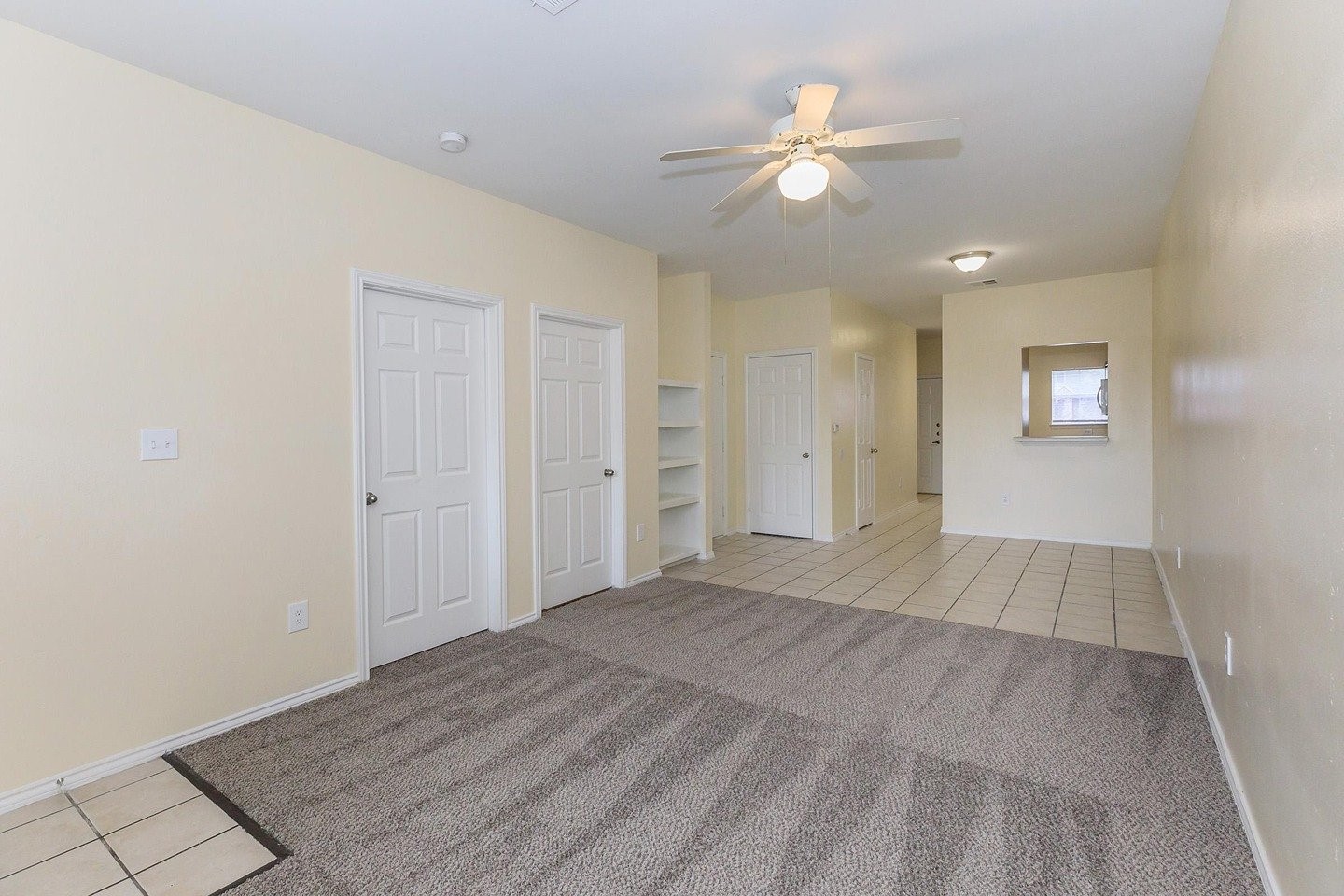 9257 Somerset Road San Antonio, TX 78211 - Photo 11 of 18 wooden floor in an empty room with a ceiling fan