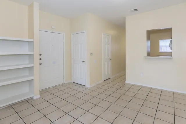 a view of an empty room and window