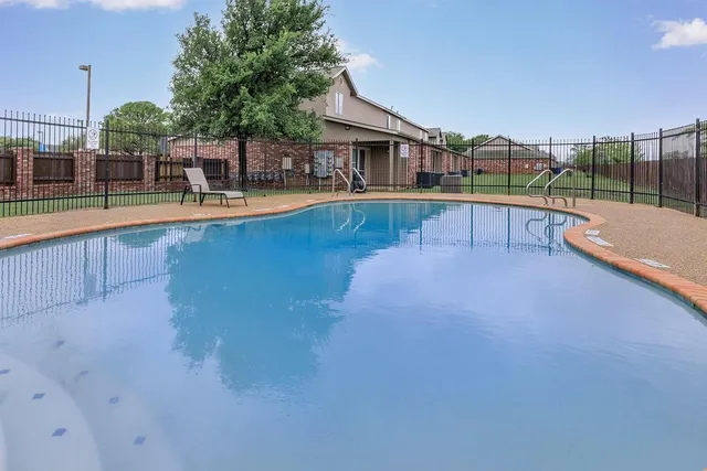 a view of a house with a swimming pool