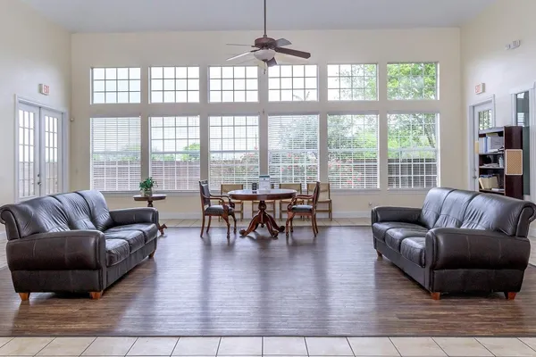 a living room with furniture and a large window