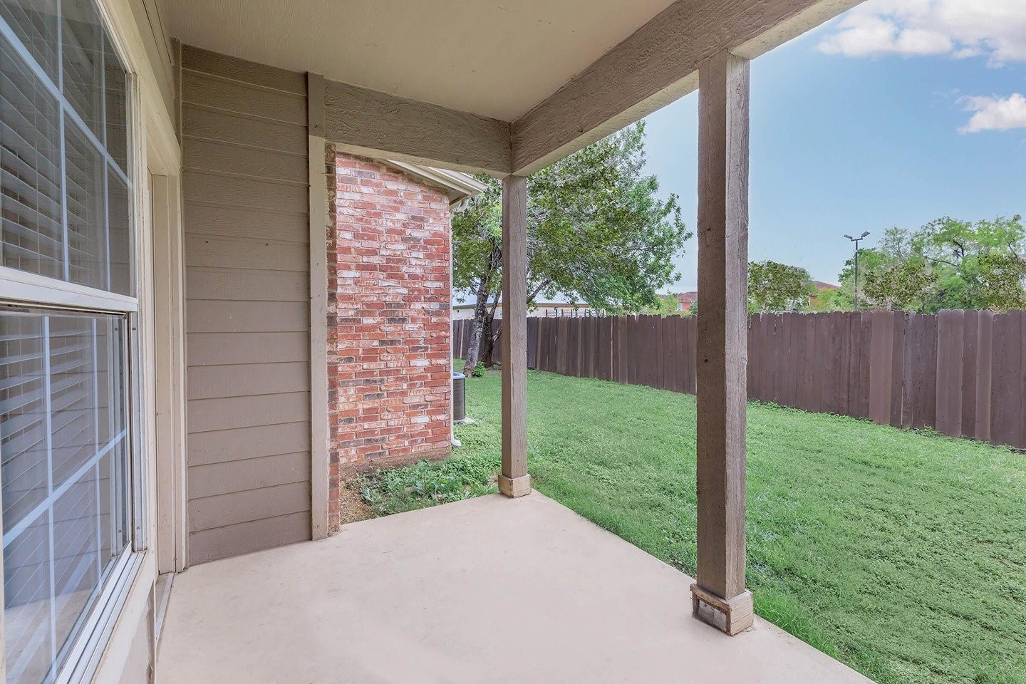 9257 Somerset Road San Antonio, TX 78211 - Photo 9 of 18 a view of a porch with a yard
