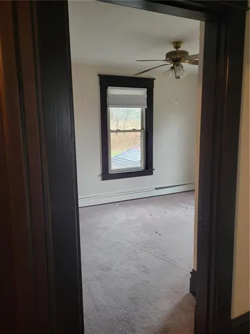a view of an empty room with a window