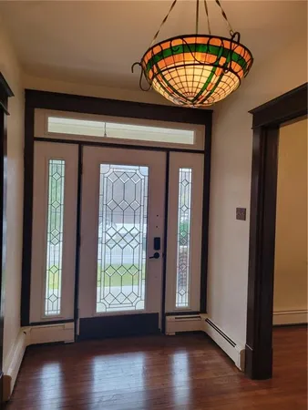 a view of entryway with wooden floor