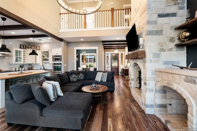 a kitchen with stainless steel appliances granite countertop a refrigerator and a stove