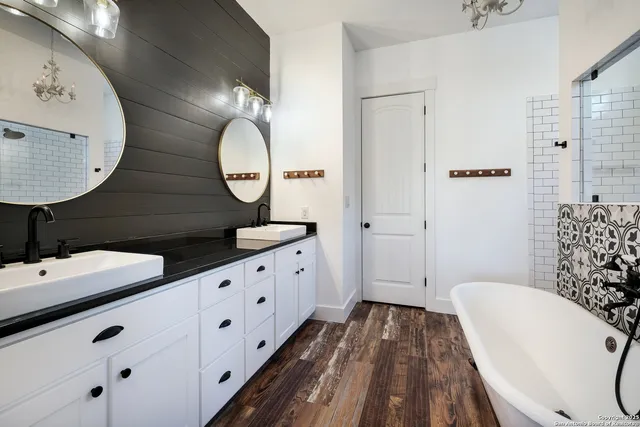 a bathroom with a bathtub and shower