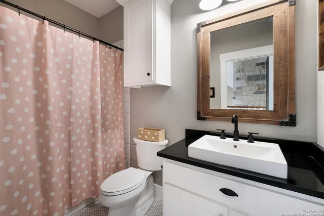 a bed room with a bed and a large window