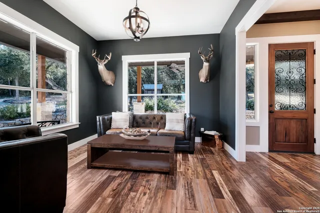 a living room with furniture and a fireplace