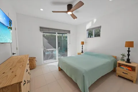 a bathroom with a tub a sink and a shower