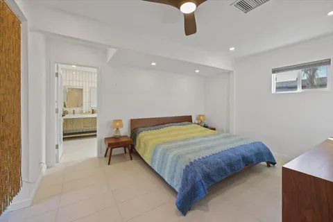 an aerial view of residential house with outdoor space and seating area