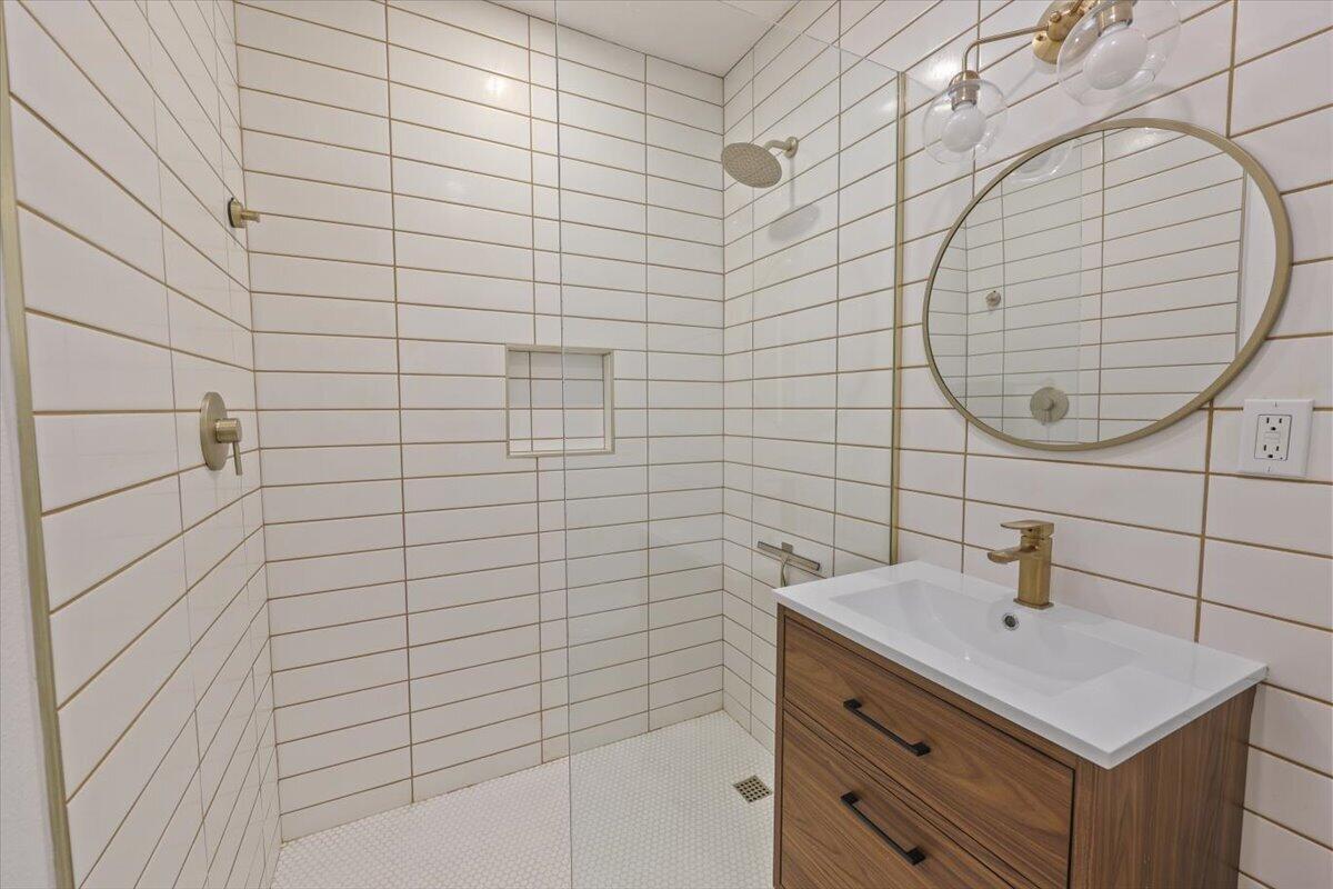 3991 Calle San Raphael Palm Springs, CA 92264 - Photo 21 of 45 a bathroom with a sink shower and a mirror