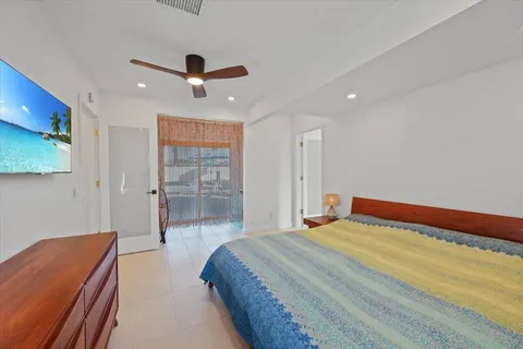 an aerial view of residential house and sandy dunes