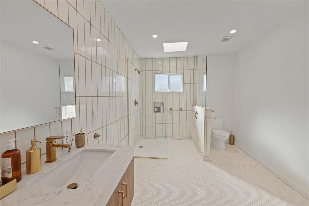 3991 Calle San Raphael Palm Springs, CA 92264 - Photo 27 of 45 a bathroom with a tub a sink and a shower