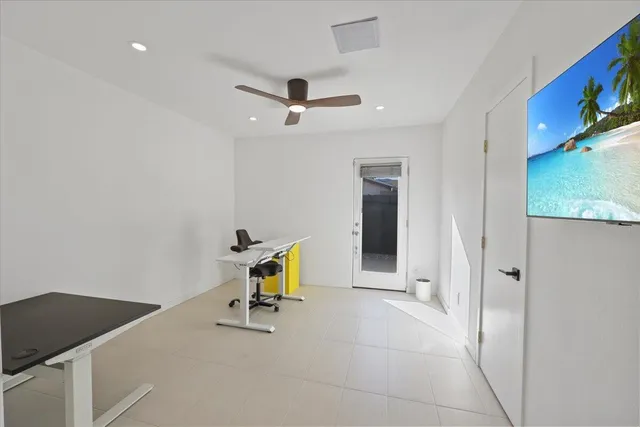 a view of a swimming pool with lounge chairs