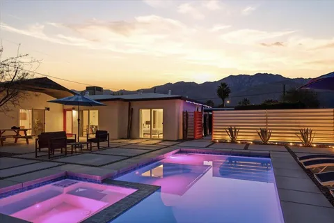 a view of a terrace with chairs and a table