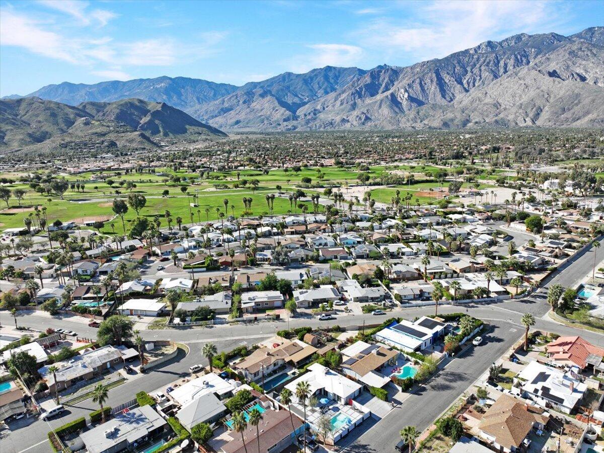 3991 Calle San Raphael Palm Springs, CA 92264 - Photo 43 of 45 an aerial view of residential house and sandy dunes
