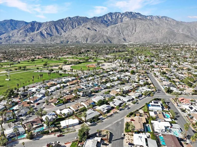 a view of a city with mountains in the background