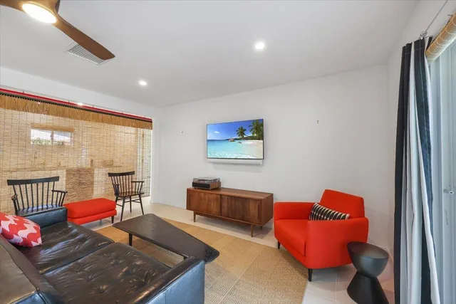 a living room with furniture and a window