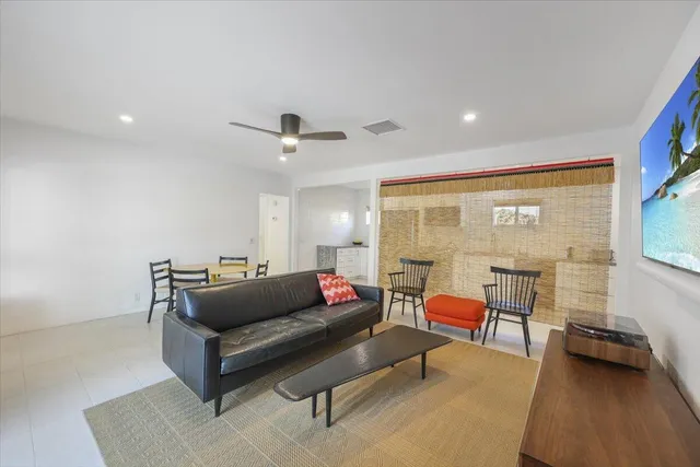 a living room with furniture and a table