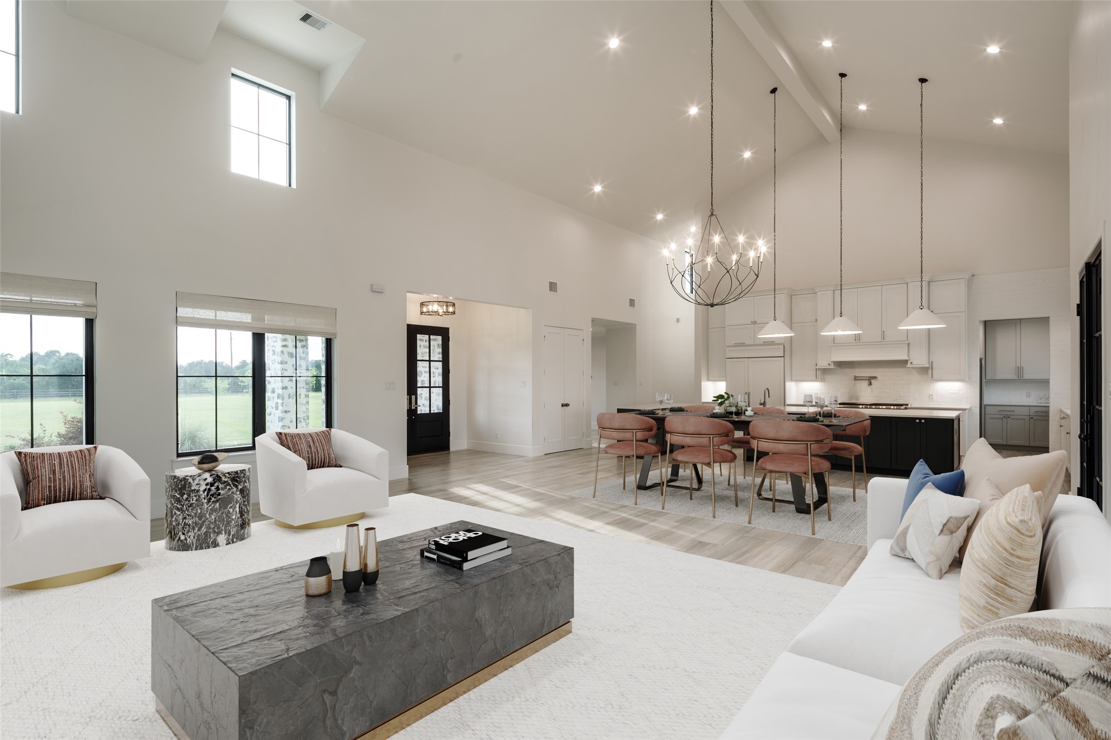 24118 Margerstadt Road Hockley, TX 77447 - Photo 9 of 46 The great room centers the home around custom built-ins, a statement fireplace, oversized gathering space, and uninterrupted views stretching toward the surrounding pasture. An oversized ceiling fan and vaulted ceiling heights reinforce both the scale and comfort of the space.