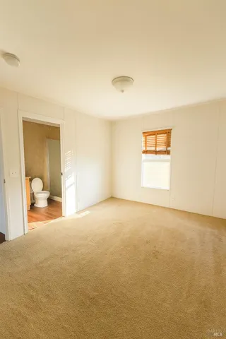 a view of a room that has a window