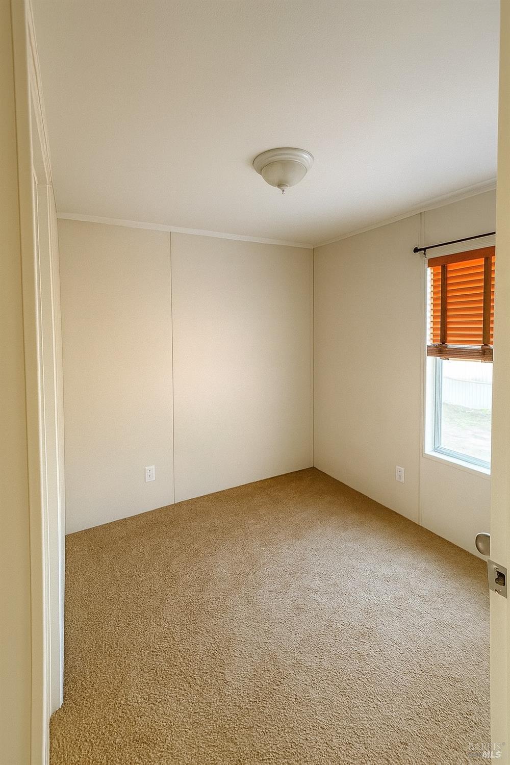 19925 South Main Street, Unit 18 Willits, CA 95490 - Photo 12 of 14 an empty room with a window