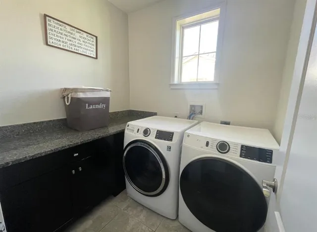 a utility room with dryer and washer