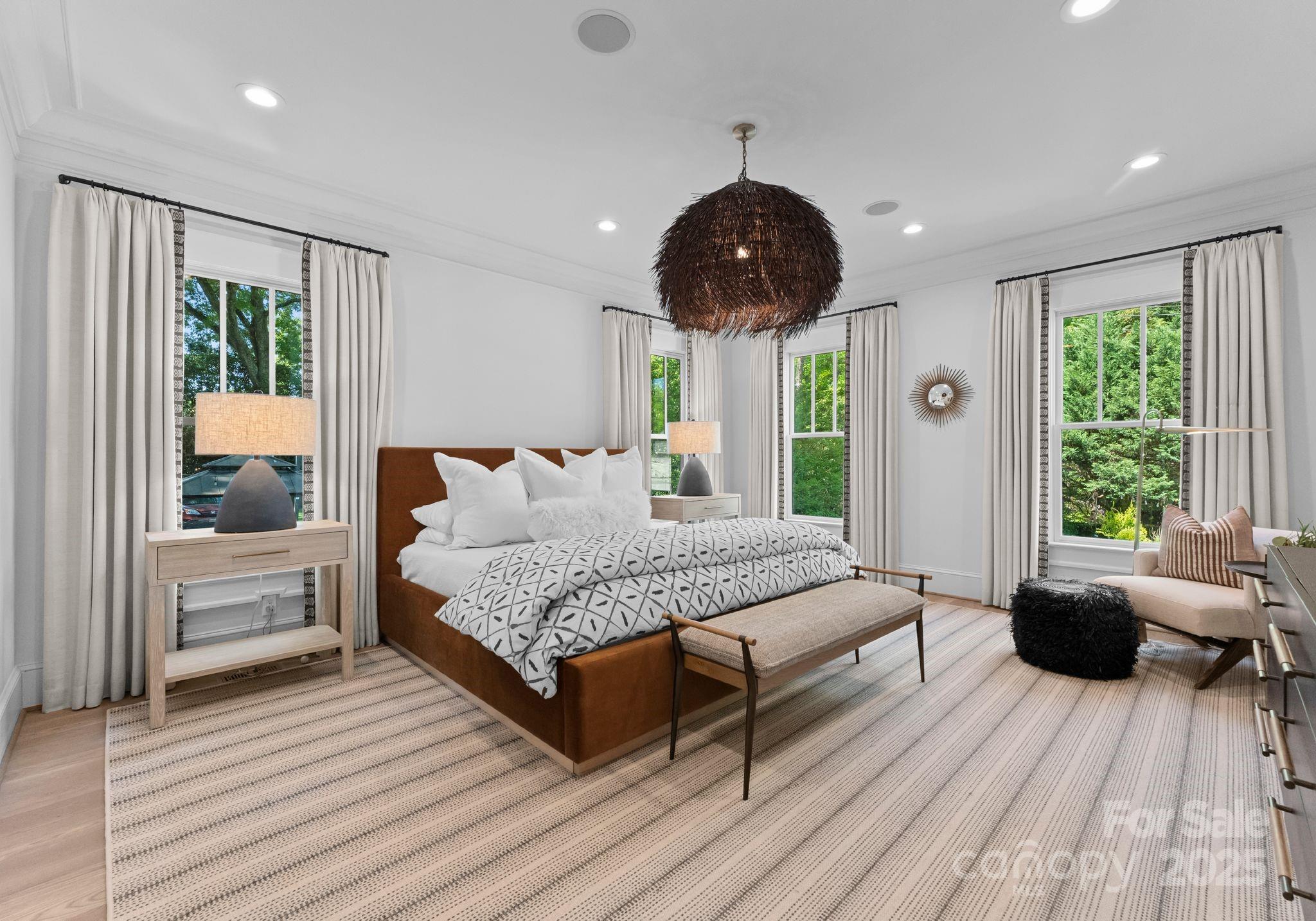 1550 Queens Road West Charlotte, NC 28207 - Photo 13 of 40 a spacious bedroom with a large bed and a large window