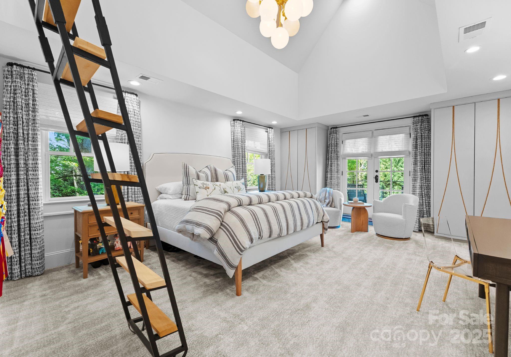 1550 Queens Road West Charlotte, NC 28207 - Photo 25 of 40 a bedroom with a bed and a large window