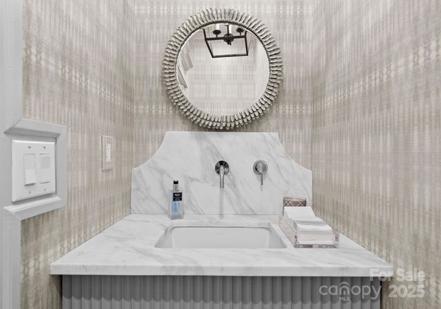 a view of a livingroom with workspace and a window