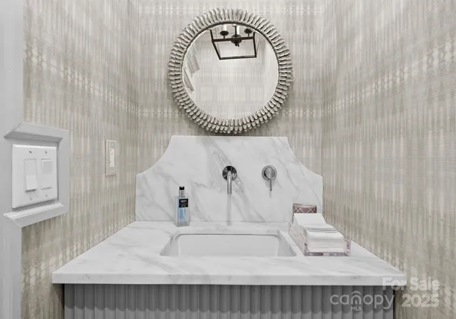 a view of a livingroom with workspace and a window