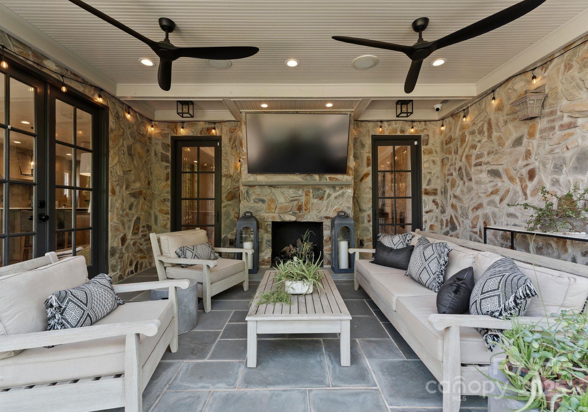 1550 Queens Road West Charlotte, NC 28207 - Photo 36 of 40 a living room with furniture and a fireplace