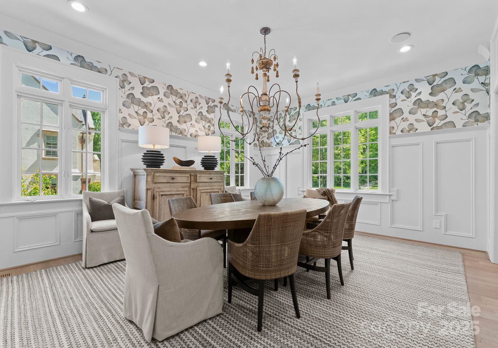 1550 Queens Road West Charlotte, NC 28207 - Photo 6 of 40 a view of a dining room with furniture and chandelier